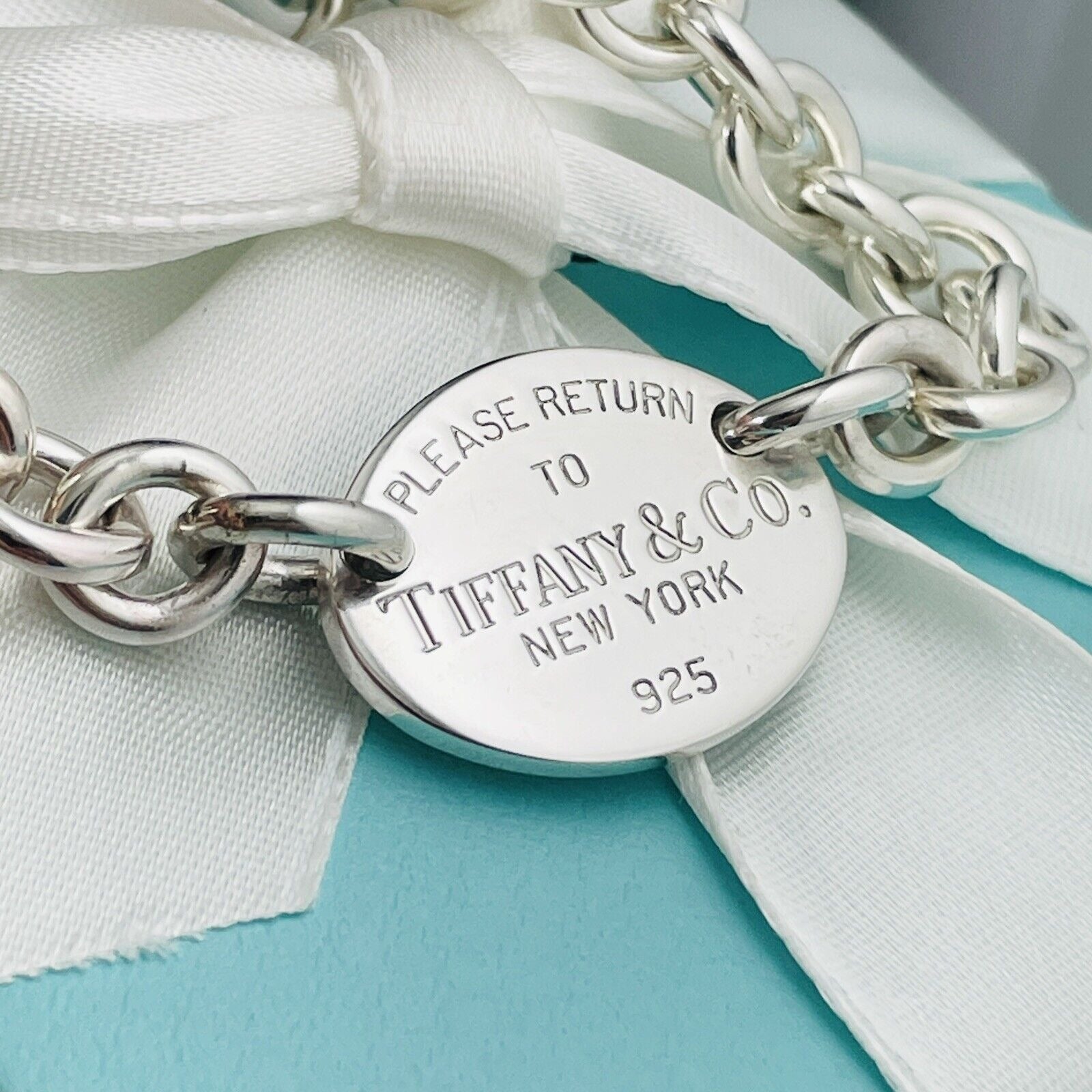 Please Return To Tiffany Co Oval Tag Charm Bracelet in Silver