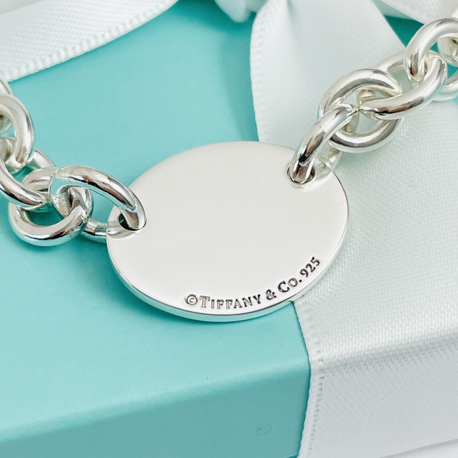 7.75” Please Return To Tiffany Oval Tag Charm Bracelet in Silver
