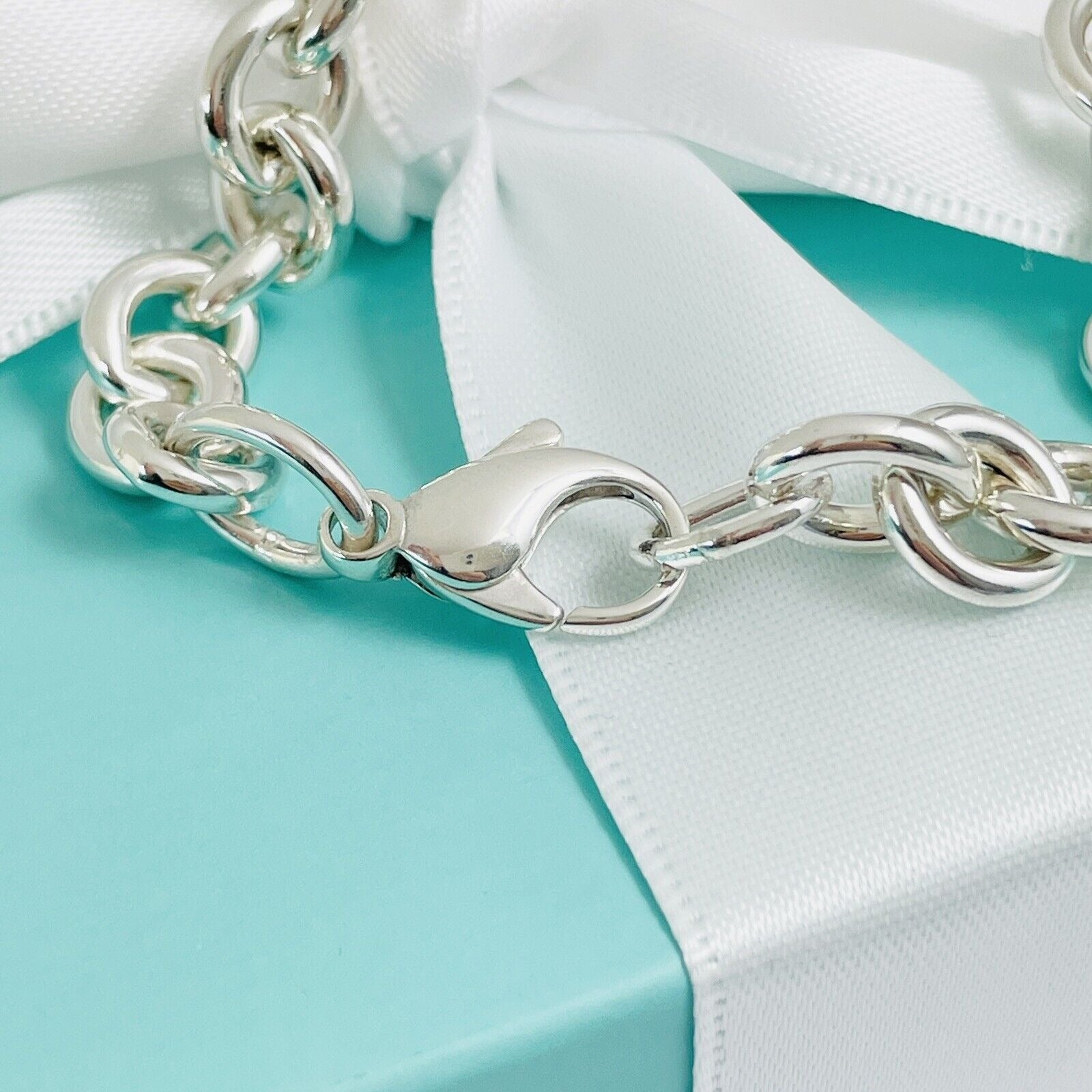 7.75” Please Return To Tiffany Oval Tag Charm Bracelet in Silver