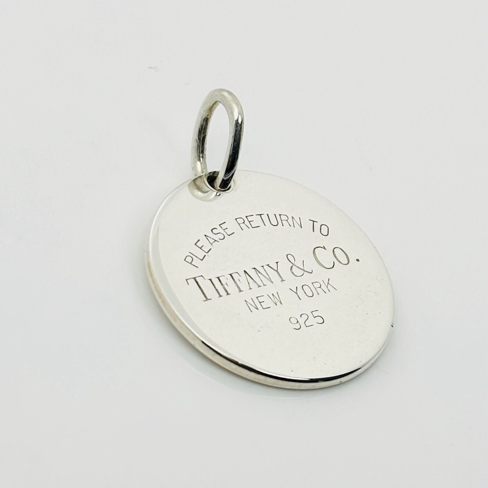 Return to Tiffany Round Tag Pendant or Charm in Sterling Silver