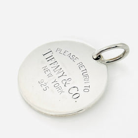 Return to Tiffany & Co Round Tag Pendant or Charm in 925 Sterling Silver - 0