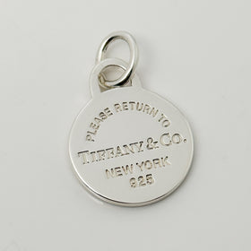 Please Return to Tiffany & Co Silver Round Tag Circle Charm or Pendant in Silver