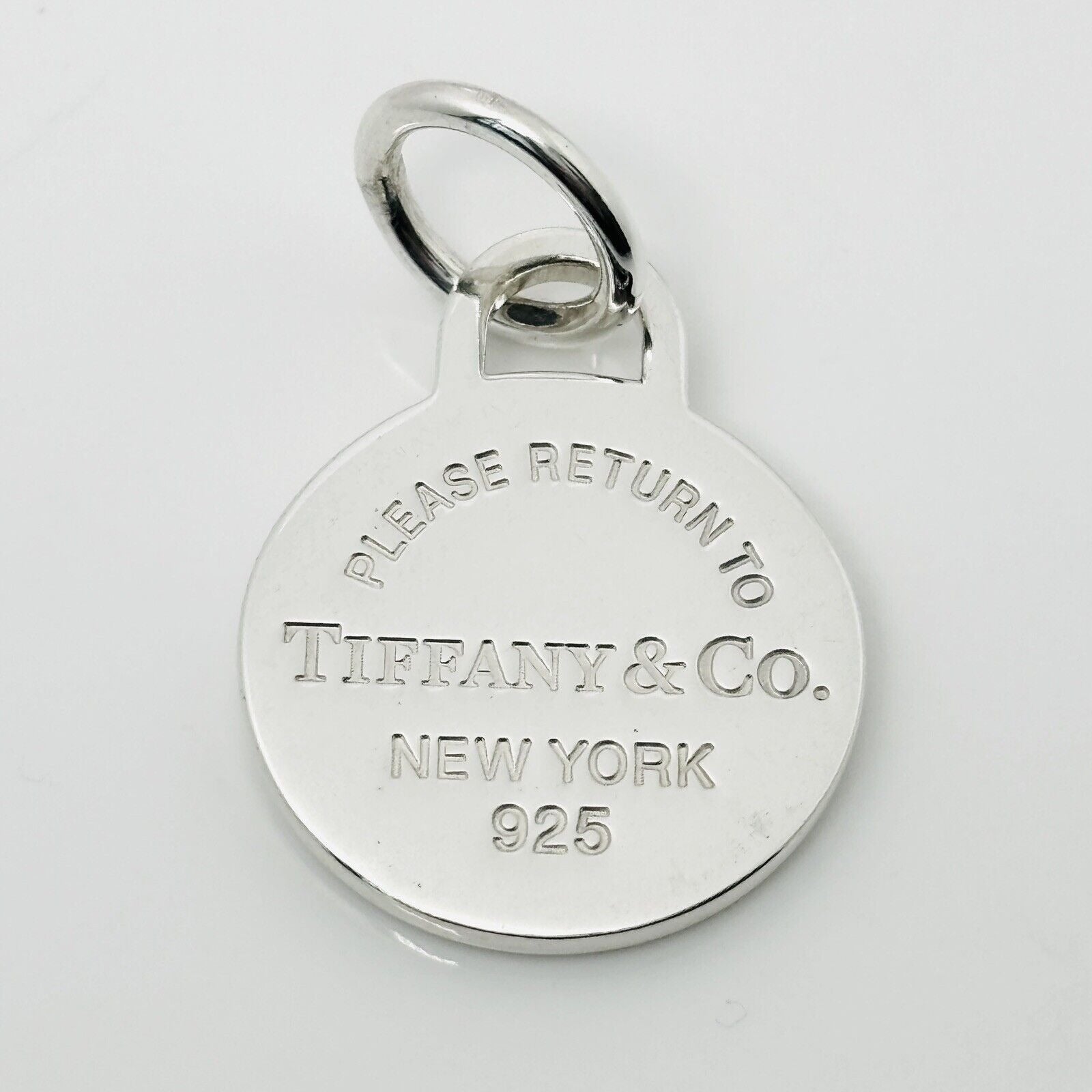 Please Return to Tiffany & Co Silver Round Tag Circle Charm or Pendant in Silver