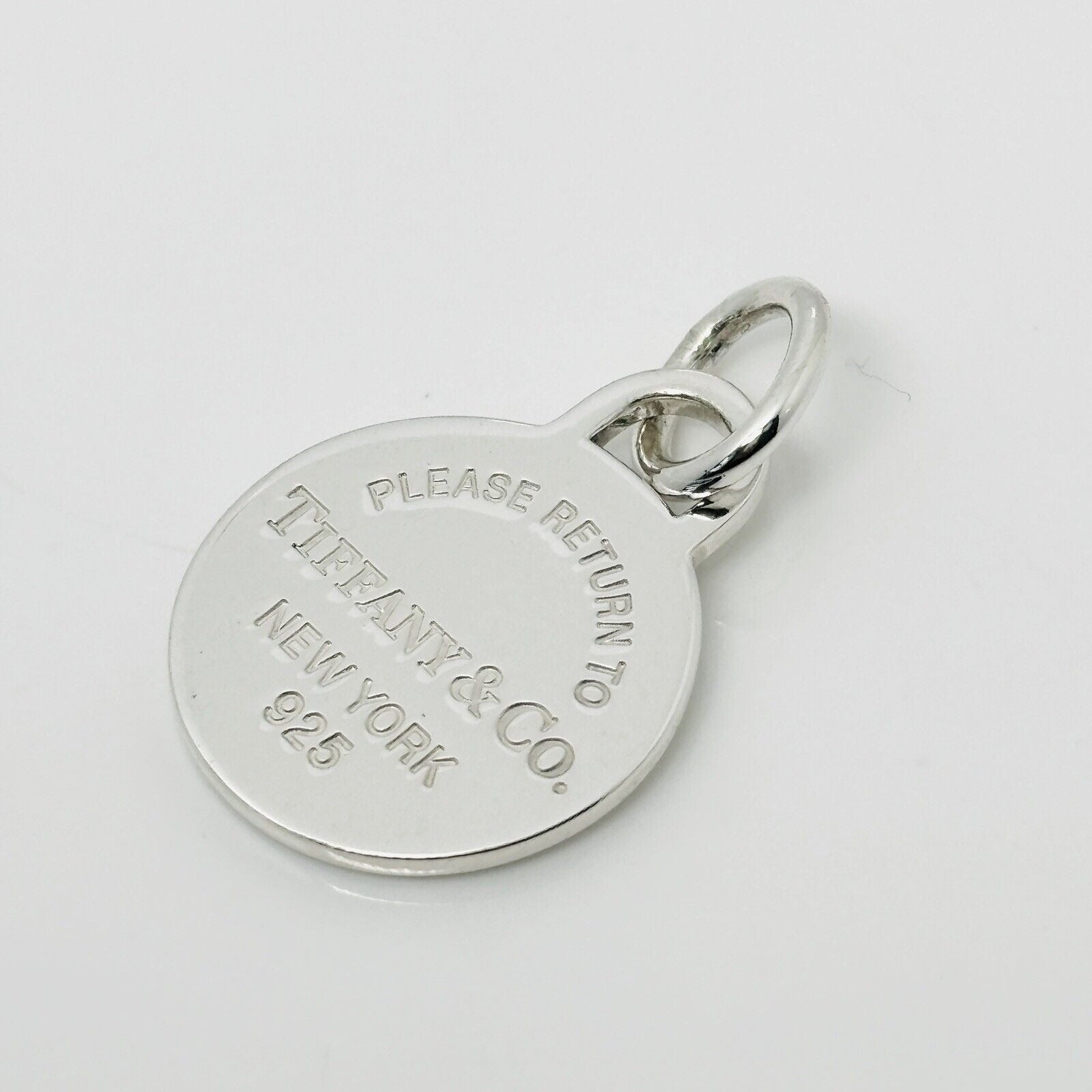 Please Return to Tiffany & Co Silver Round Tag Circle Charm or Pendant in Silver
