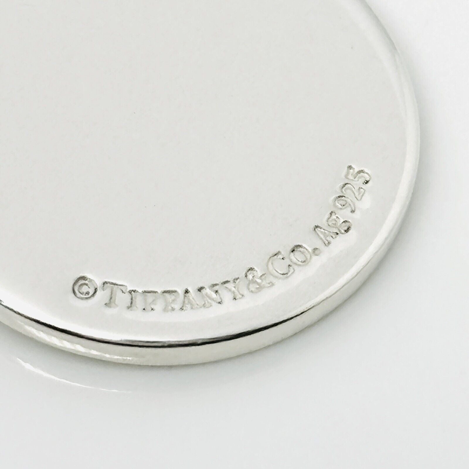 Please Return to Tiffany & Co Silver Round Tag Circle Charm or Pendant in Silver