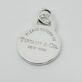Please Return to Tiffany & Co Silver Round Tag Circle Charm or Pendant in Silver
